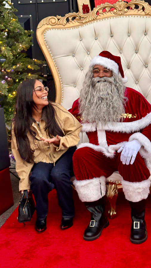 Soulful Santa smiling with family during home visit (gallery photo 5)